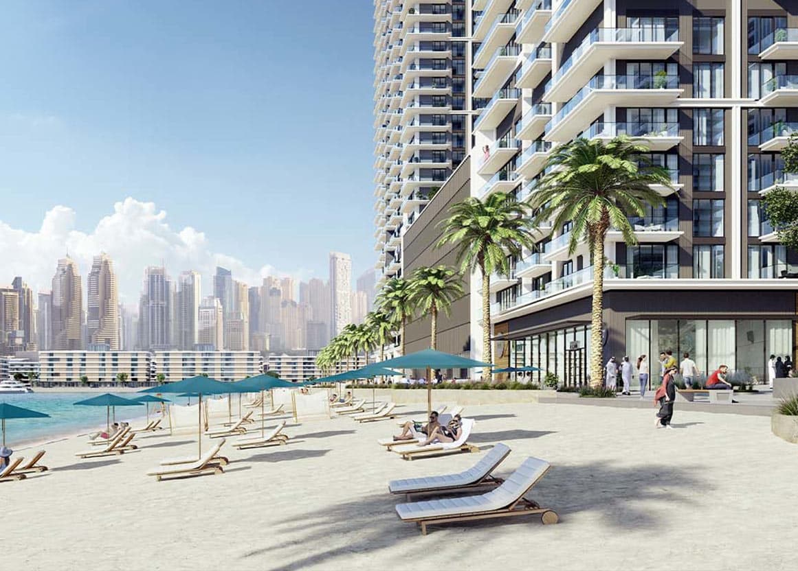 Residents-only private beach at Emaar Beachfront with palm trees and Dubai Marina skyline behind